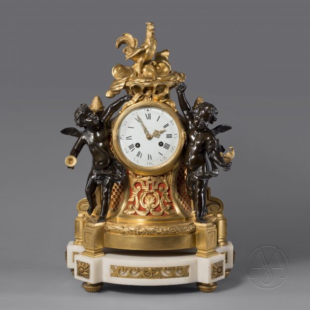 Pendule figurative en bronze patiné et doré de style Louis XVI