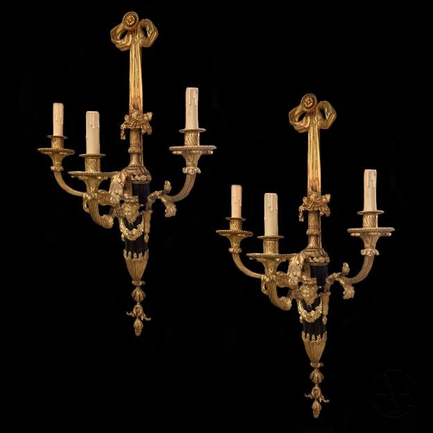 A Pair of Patinated and Gilt-Bronze Three-Branch Wall Appliques
