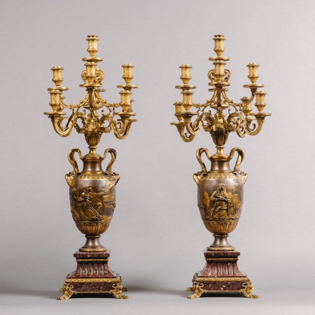 A Fine Pair of Neoclassical Style Gilt and Patinated Bronze Nine-Light Candelabra