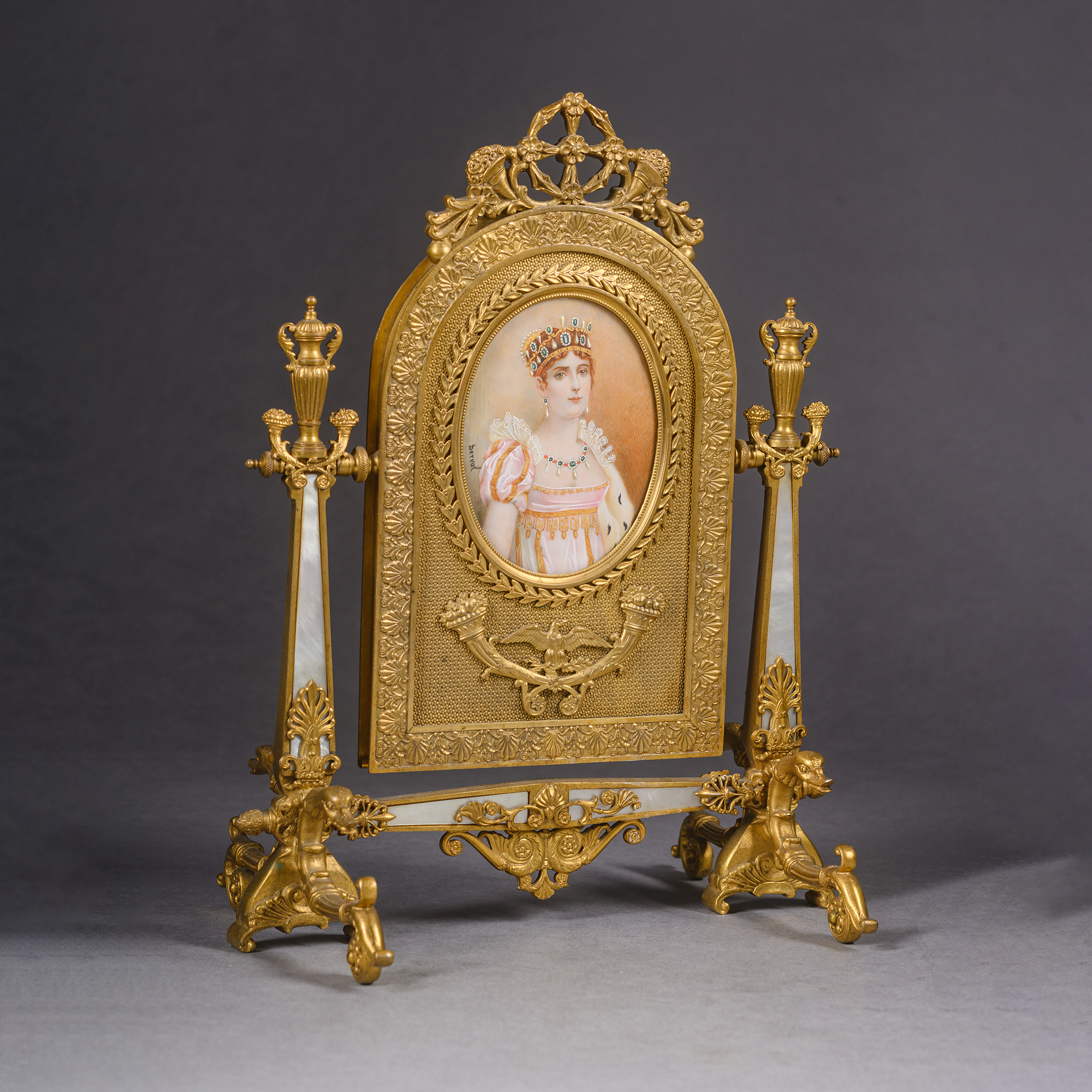 Elegant Empire style gilt-bronze and mother of pearl table mirror, France circa 1900, signed Derval and featuring a portrait miniature of Empress Joséphine after François Gérard.