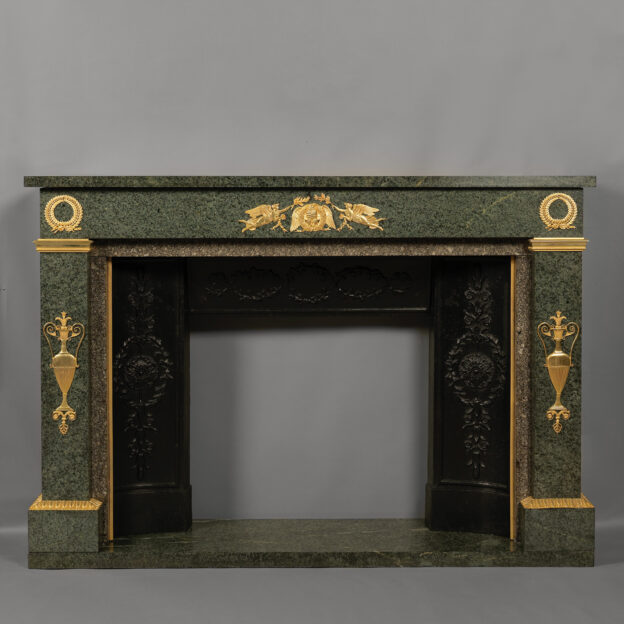 An Empire Style Gilt-Bronze Mounted Green Granite Fireplace