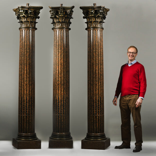 A Set of Three Neoclassical Style Gilt-Bronze and Rose Granite Corinthian Columns After The Model by Pierre Gouthière