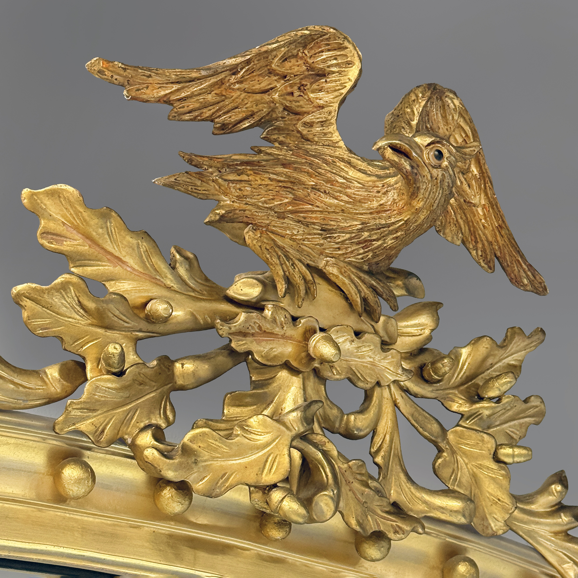 detail of the carved eagle cresting on an English mirror