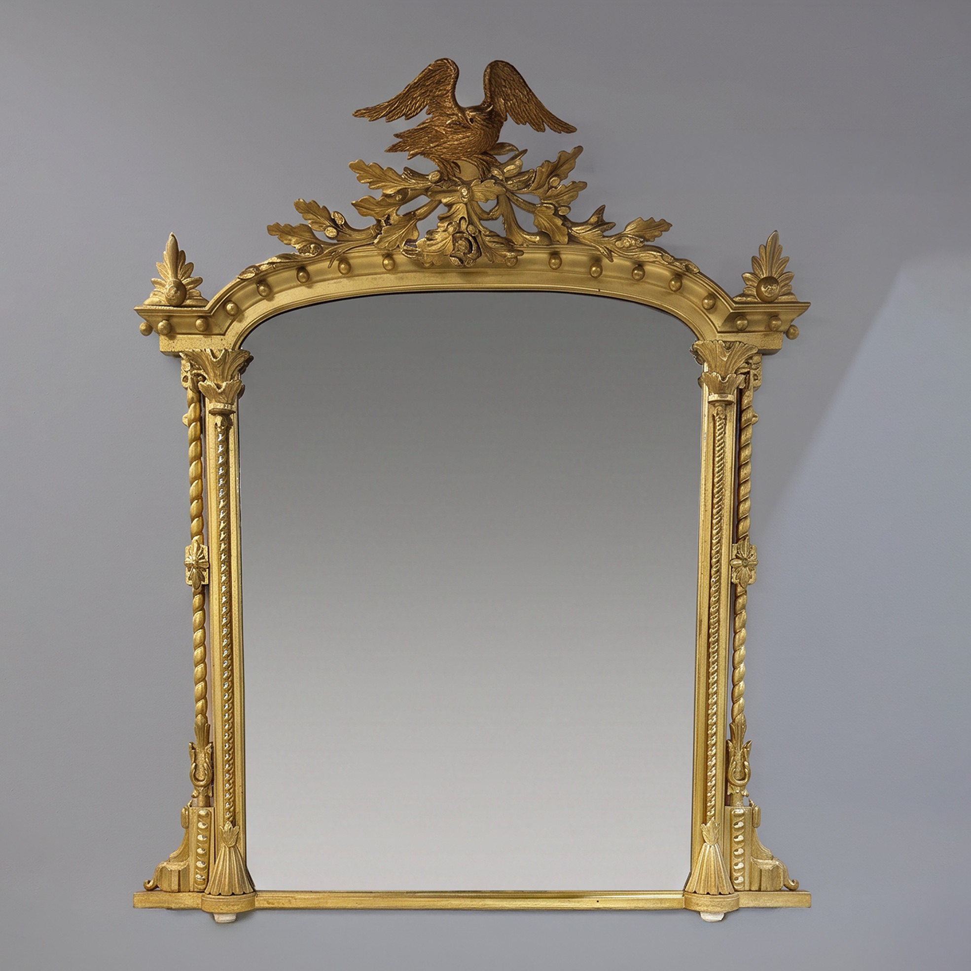 A carved giltwood mirror with Eagle cresting