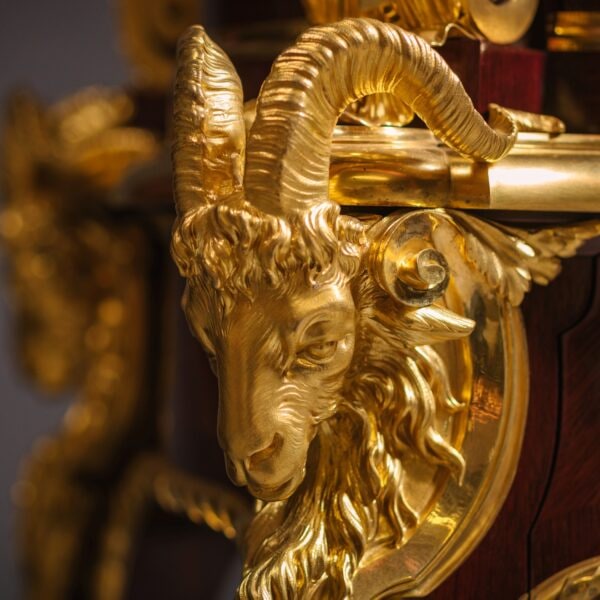 Detail of the ormolu rams head mount to an important exhibition cabinet by Beurdeley