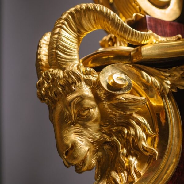 Detail of the ormolu rams head mount to an important exhibition cabinet by Beurdeley
