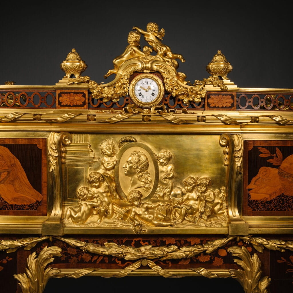 Detail of the fine gilt-bronze plaque and clock on the Bureau Roi desk by Beurdeley