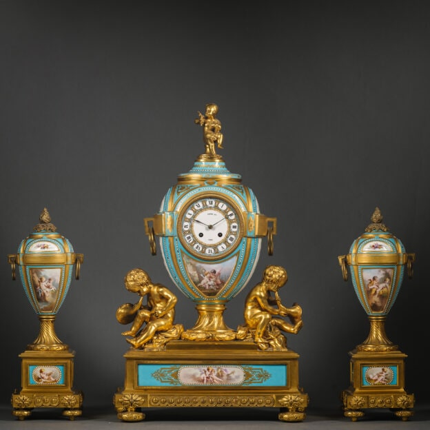 A Fine Napoleon III Gilt-Bronze and Sèvres-Style Turquoise-Ground Porcelain Three-Piece Clock Garniture
