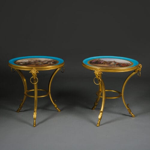 A Fine and Unusual Pair of Napoleon III Gilt-Bronze Low Side Tables With Sèvres-Style Porcelain Tops