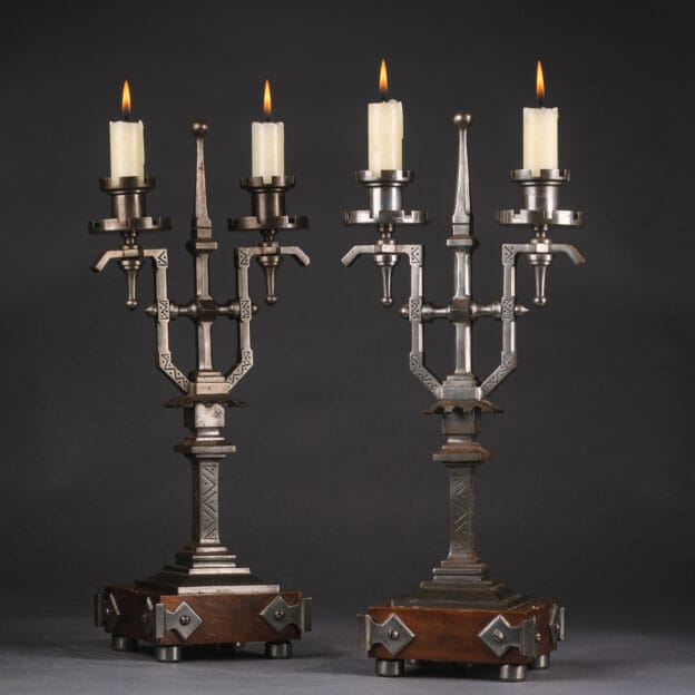 An Unusual Pair of English Aesthetic Style Steel and Walnut Two-Light Candelabra