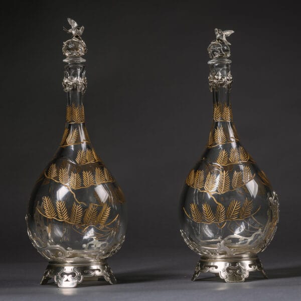 A Pair of ‘Japonaise’ Style Silver Plated and Engraved Glass Decanters, In the Manner of Christofle