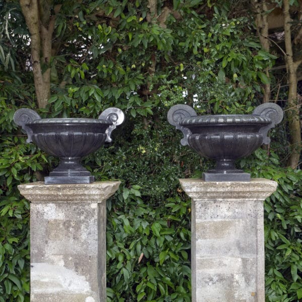 A Large and Impressive Near Pair of Green Granite Urns