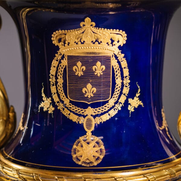 An Important Pair of Sèvres Style Gilt-Bronze Mounted Cobalt Blue Porcelain Vases With Arms for the Royal House of Bourbon