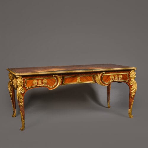A Louis XIV Style Gilt-Bronze Mounted Mahogany Bureau Plat By Cueunières, Paris, After the Model by Charles Cressent