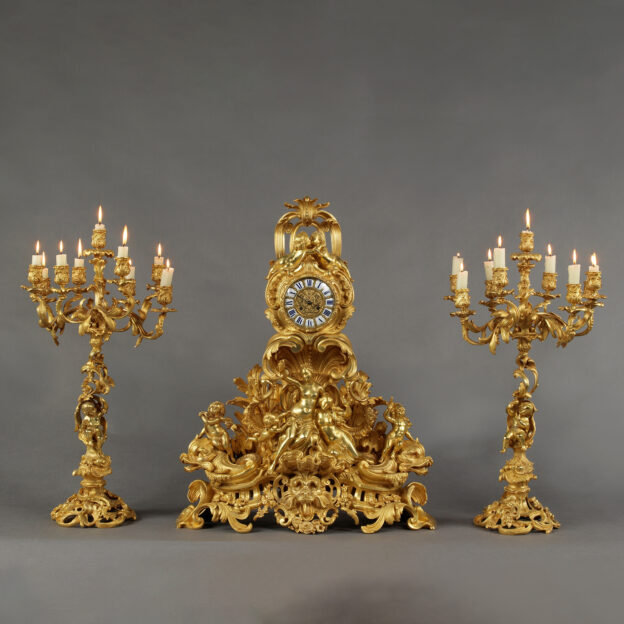 A Large Louis XV Style Gilt-Bronze Figural Clock Garniture