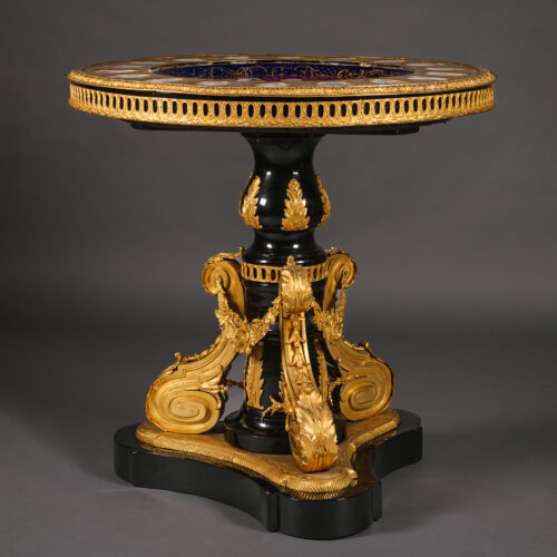 A Napoleon III Gilt-Bronze and Sèvres-Style Porcelain Mounted Ebonised Centre Table