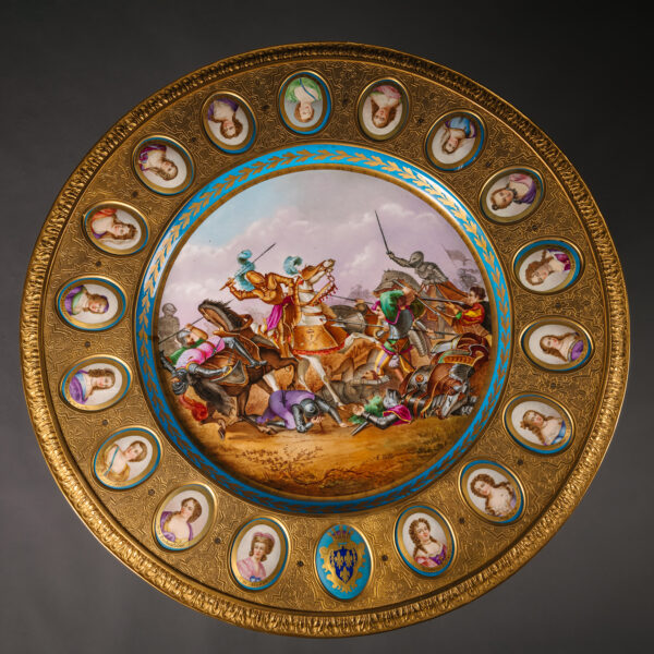 A Napoleon III Gilt-Bronze and Sèvres-Style Porcelain Mounted Ebonised Centre Table.