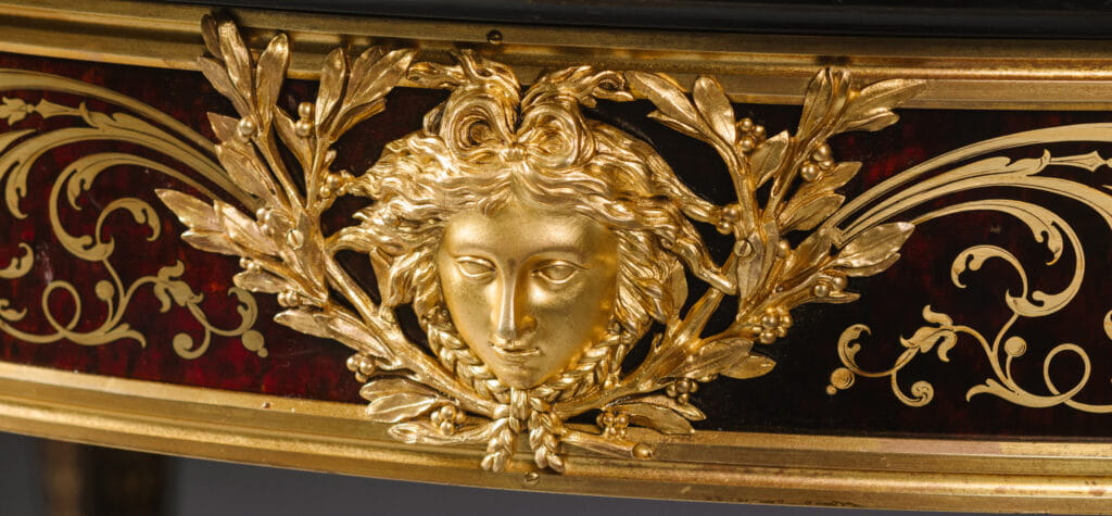 Henry Dasson Louis XIV style Boulle centre table with gilt-bronze Apollo masks
