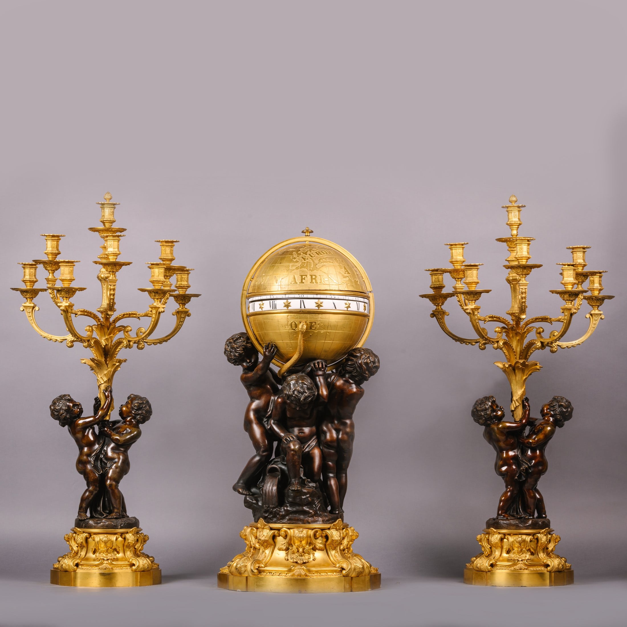 A Rare Monumental Cercles Tournants Clock Garniture