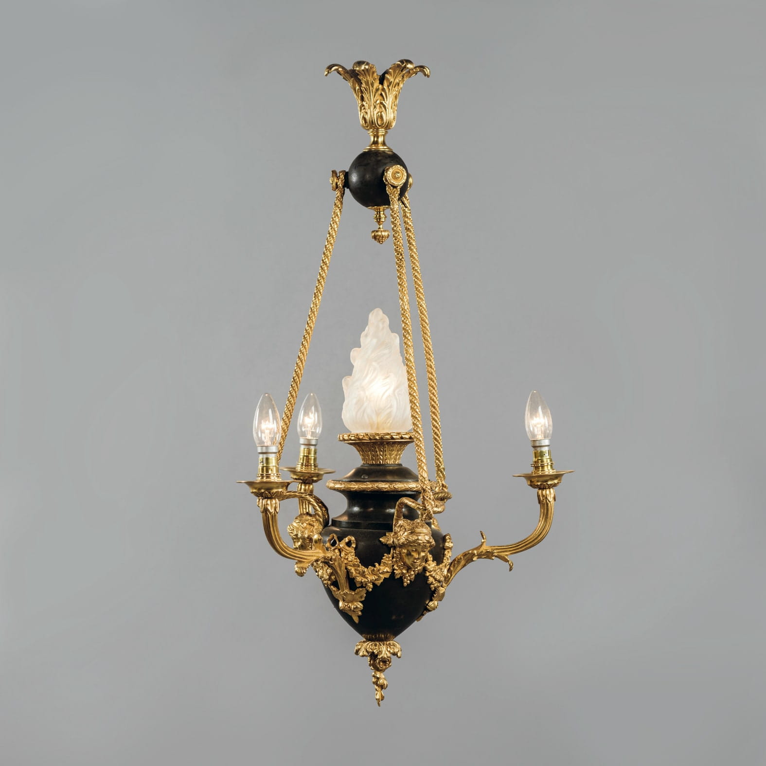 A Louis XVI Style Gilt and Patinated Bronze Four-Light Chandelier
