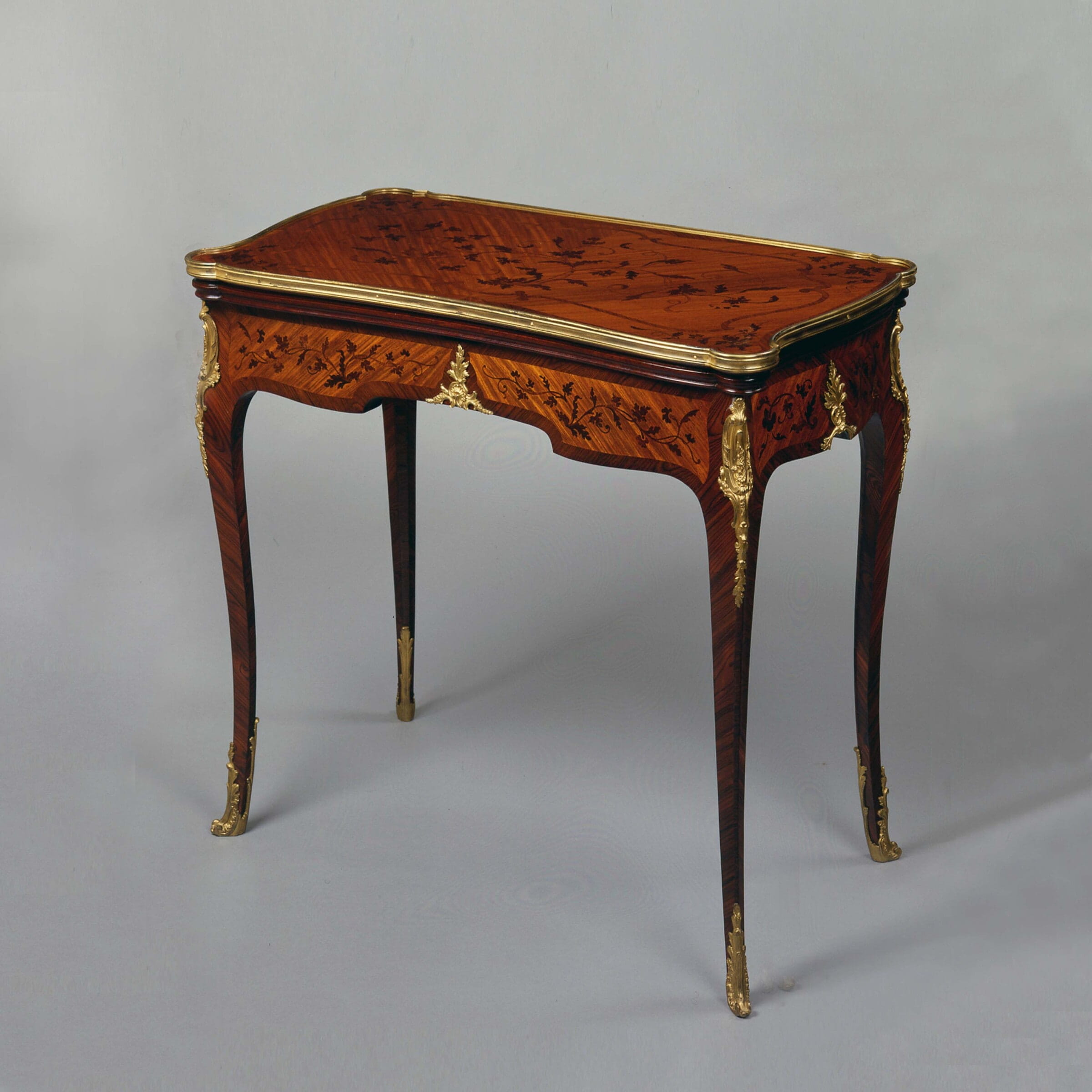 A Louis XV Style Marquetry Card Table