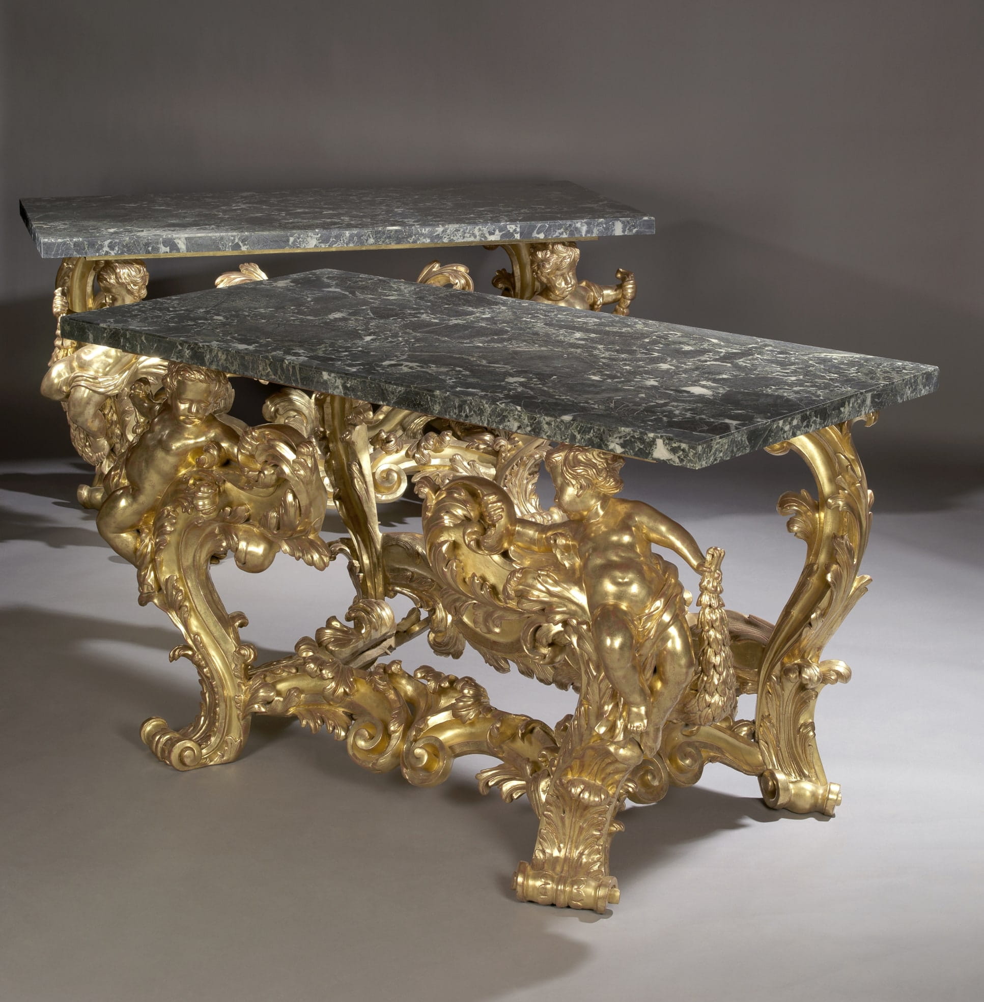 A Magnificent and Important Pair of Palatial Giltwood Console Tables with Verde Antico Marble Tops