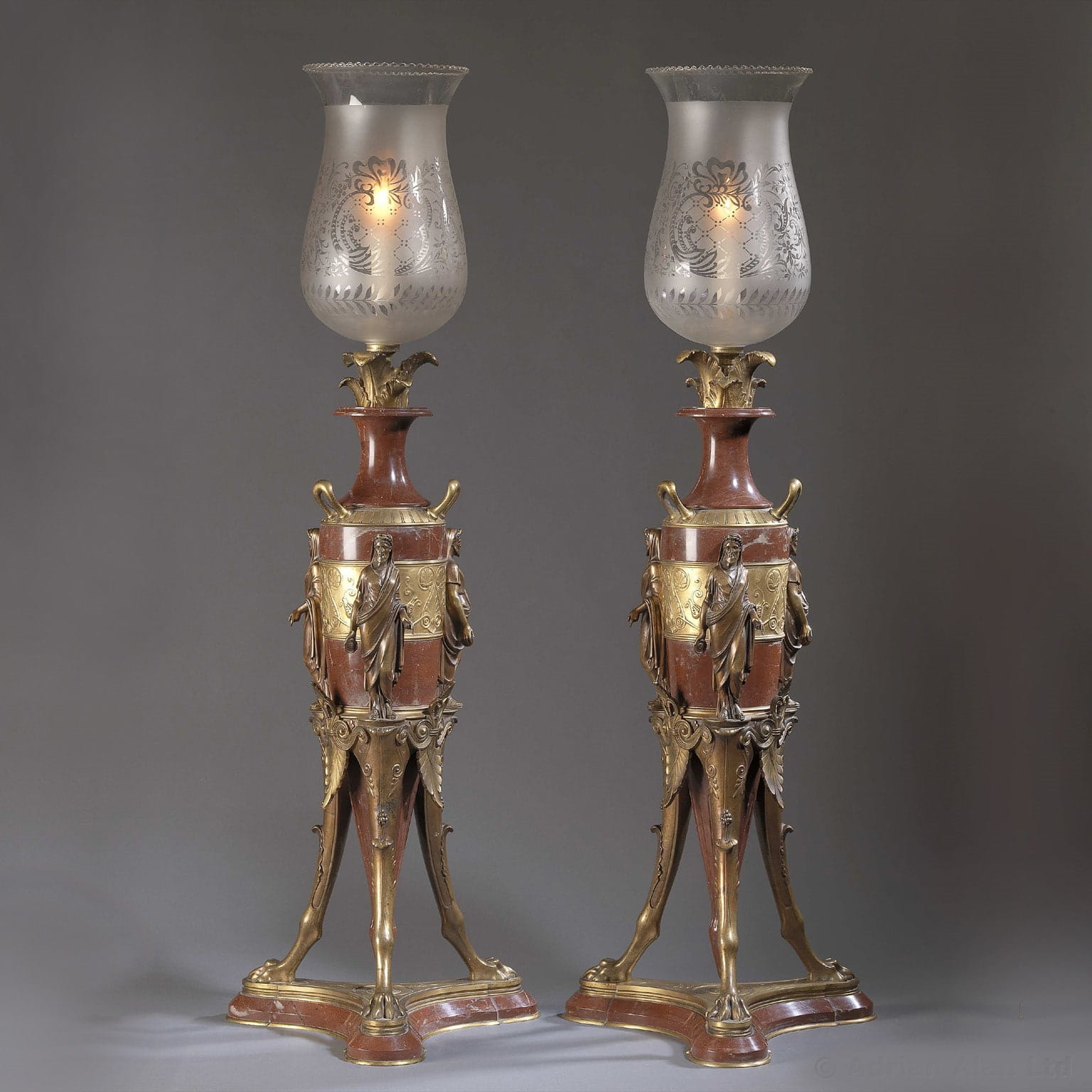 A Fine Pair of Patinated Bronze and Rouge Marble Candelabra