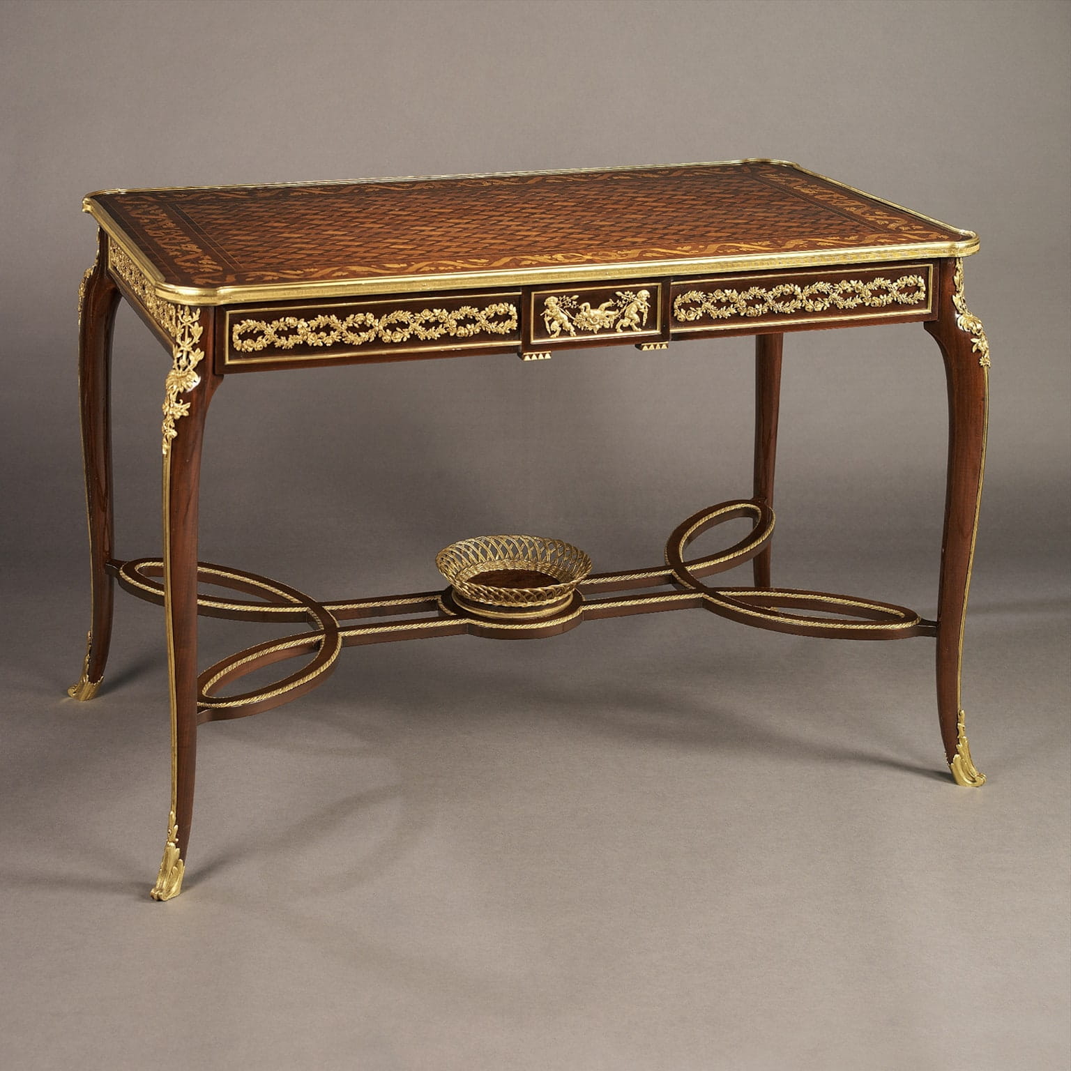 A Fine Louis XVI Style Mahogany and Marquetry Centre Table