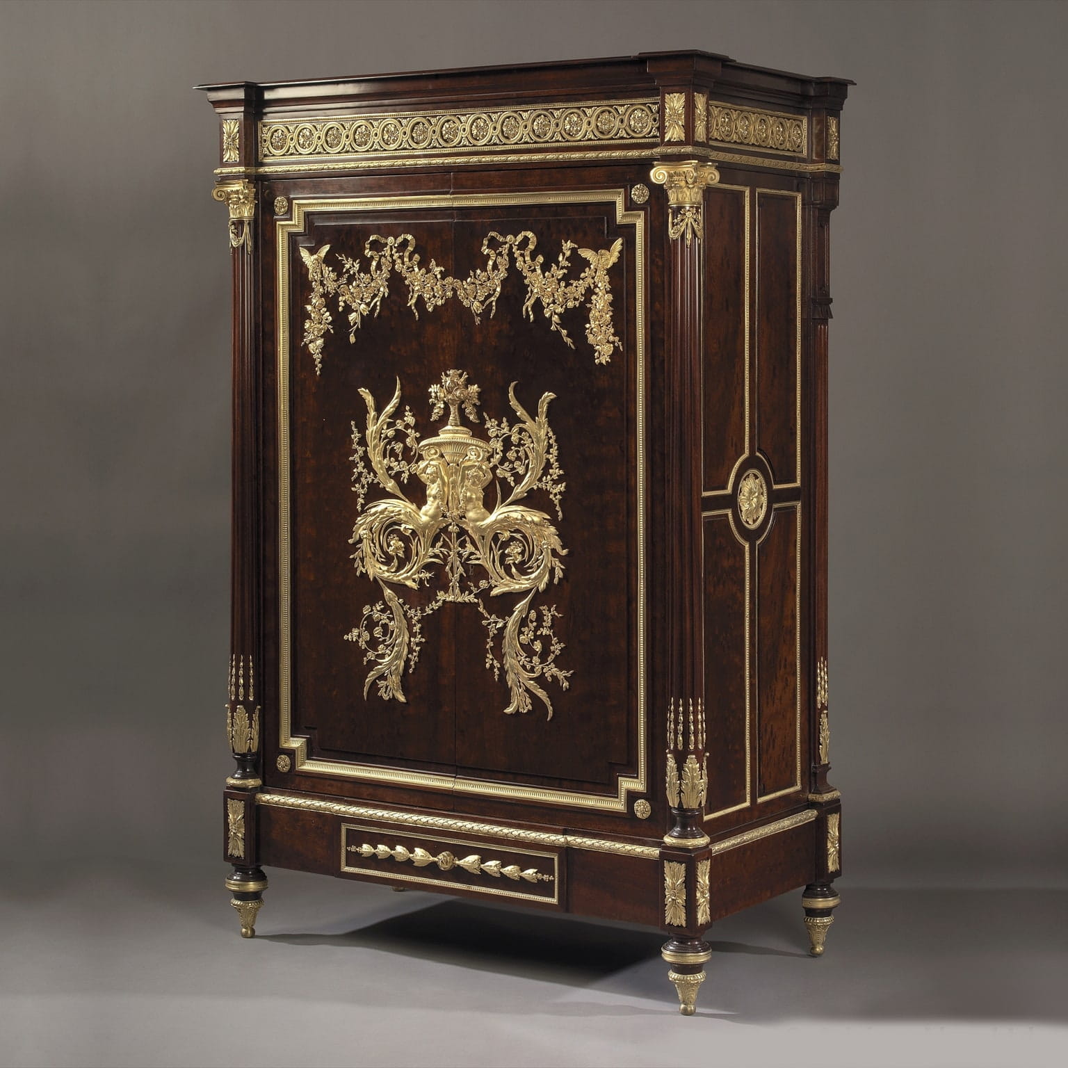 A Louis XVI Style Gilt-Bronze Mounted Mahogany Bas d’Armoire