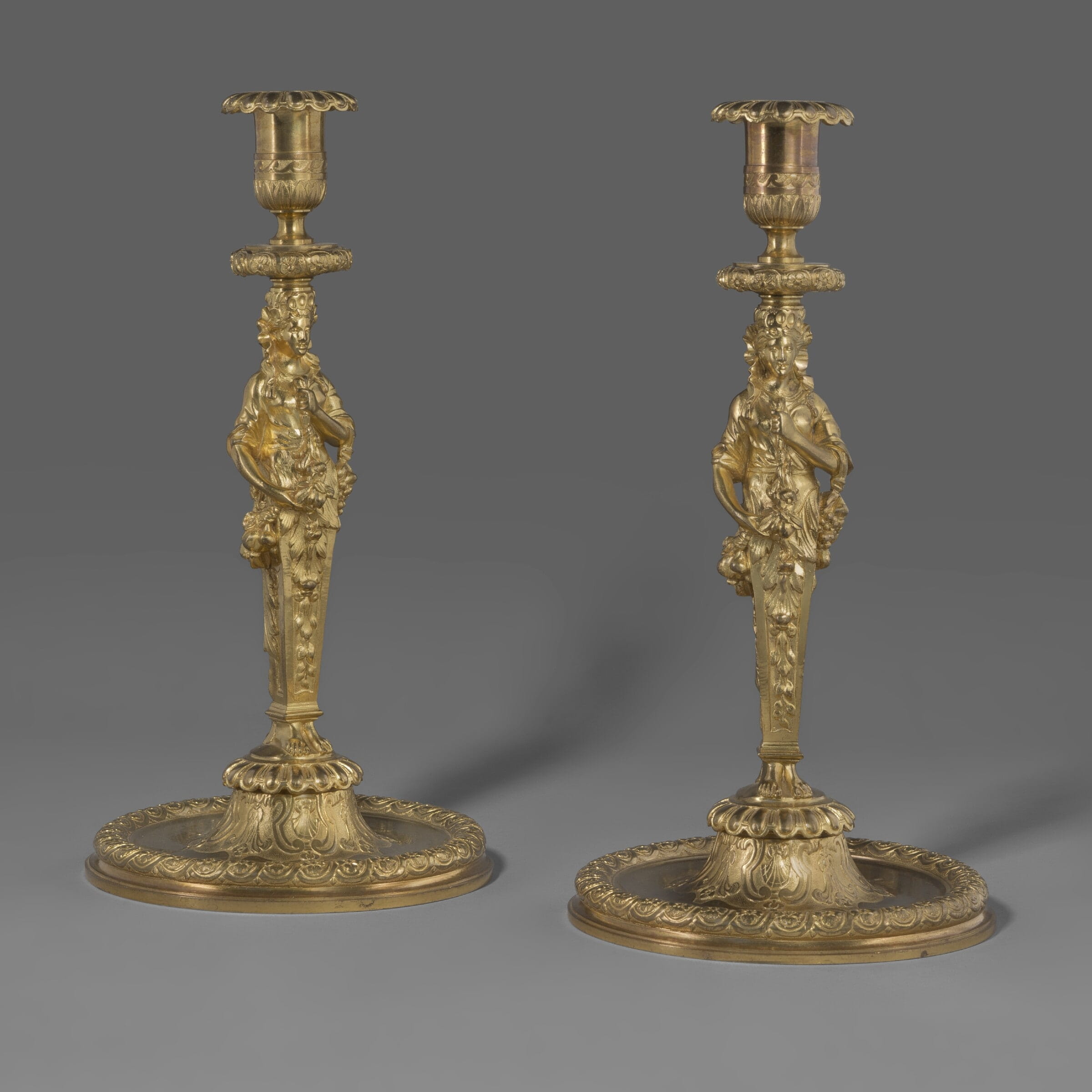 A Fine Pair of Louis XIV Style Gilt-Bronze Figural Candlesticks