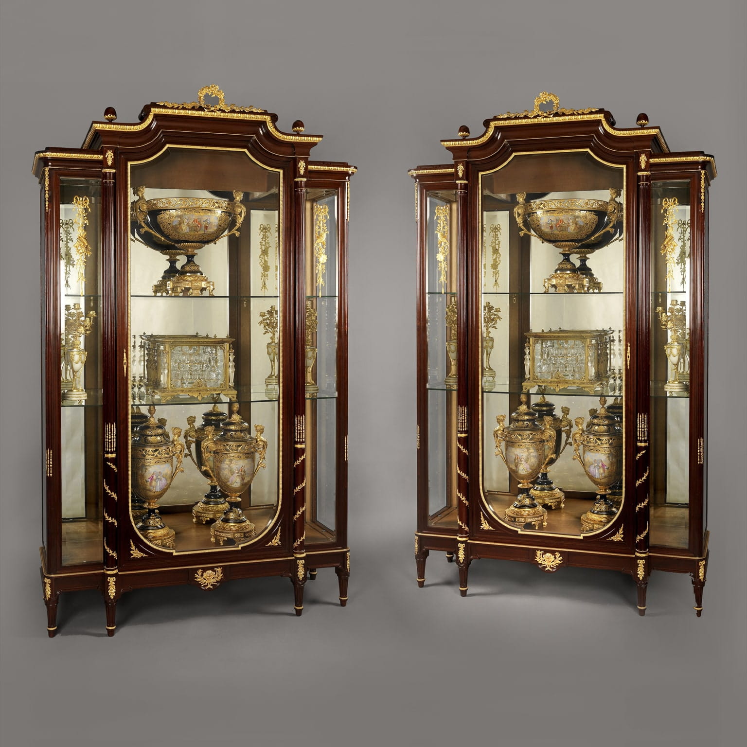 A Pair of Louis XVI Style Mahogany Vitrines