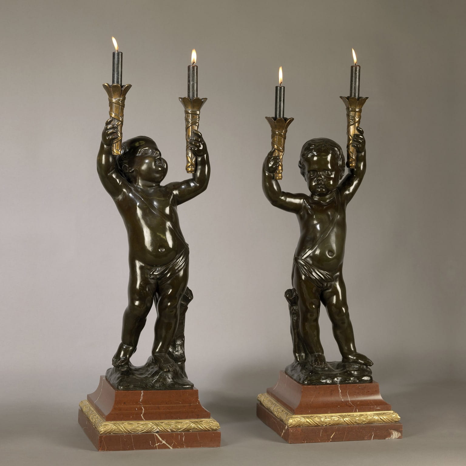 A Fine Pair of Patinated Bronze Figural Torchères