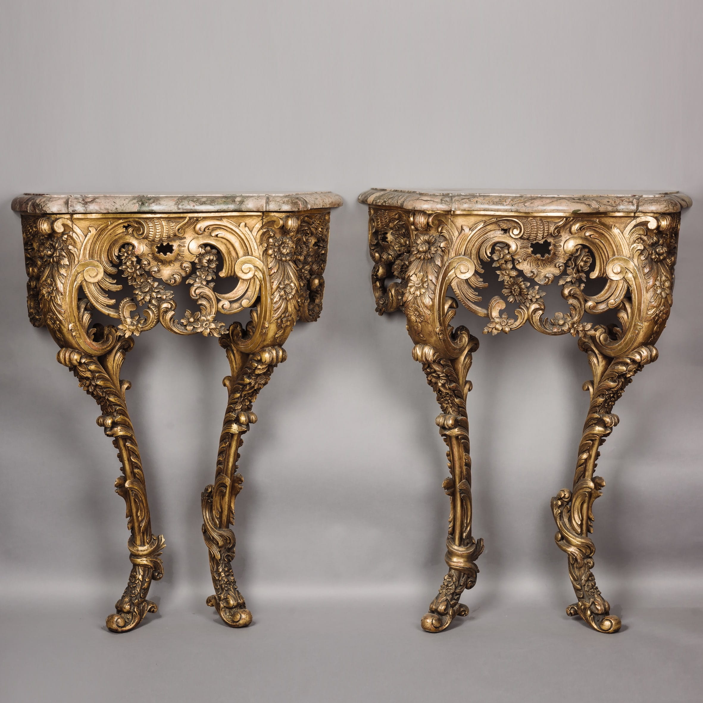 An Unusual Pair of Petit Rococo Revival Giltwood Console Tables