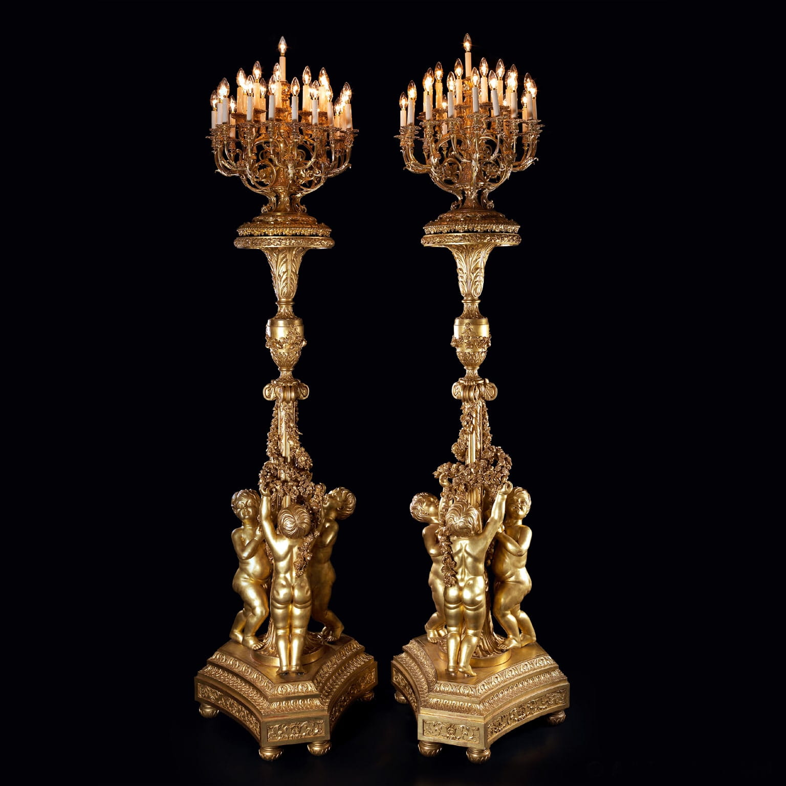 An Important Pair of Monumental Giltwood Torchères