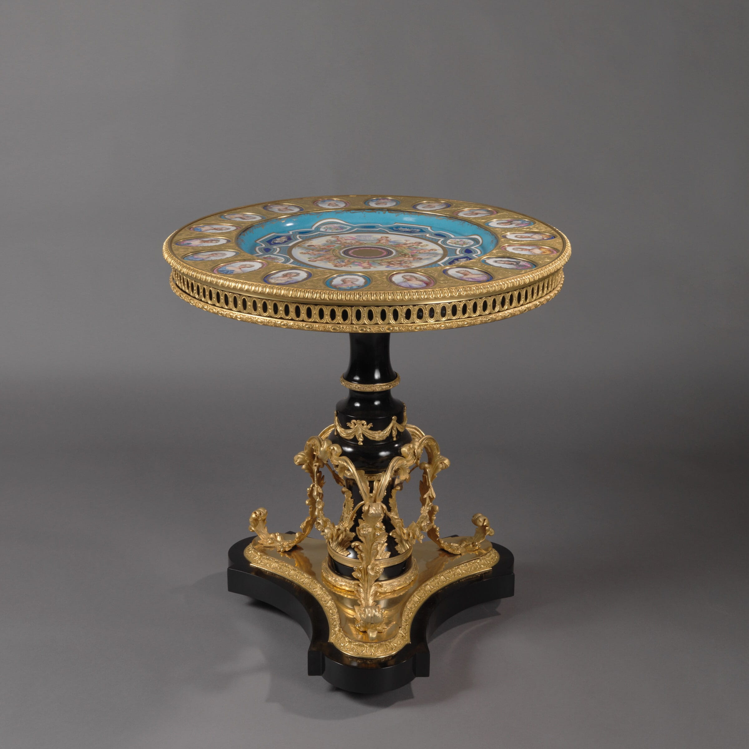 A Fine Louis XVI Style Gueridon with Sèvres Style Porcelain Plaques
