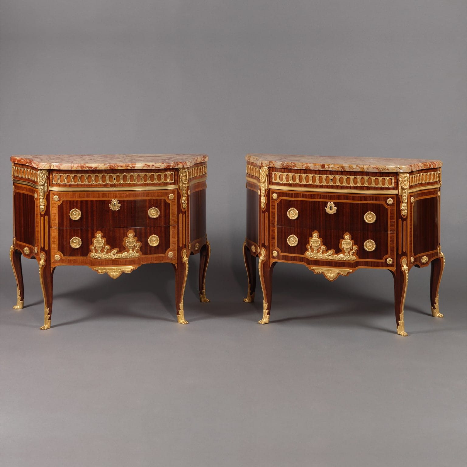A Fine Pair of Transitional Style Gilt-Bronze Mounted Parquetry Commodes