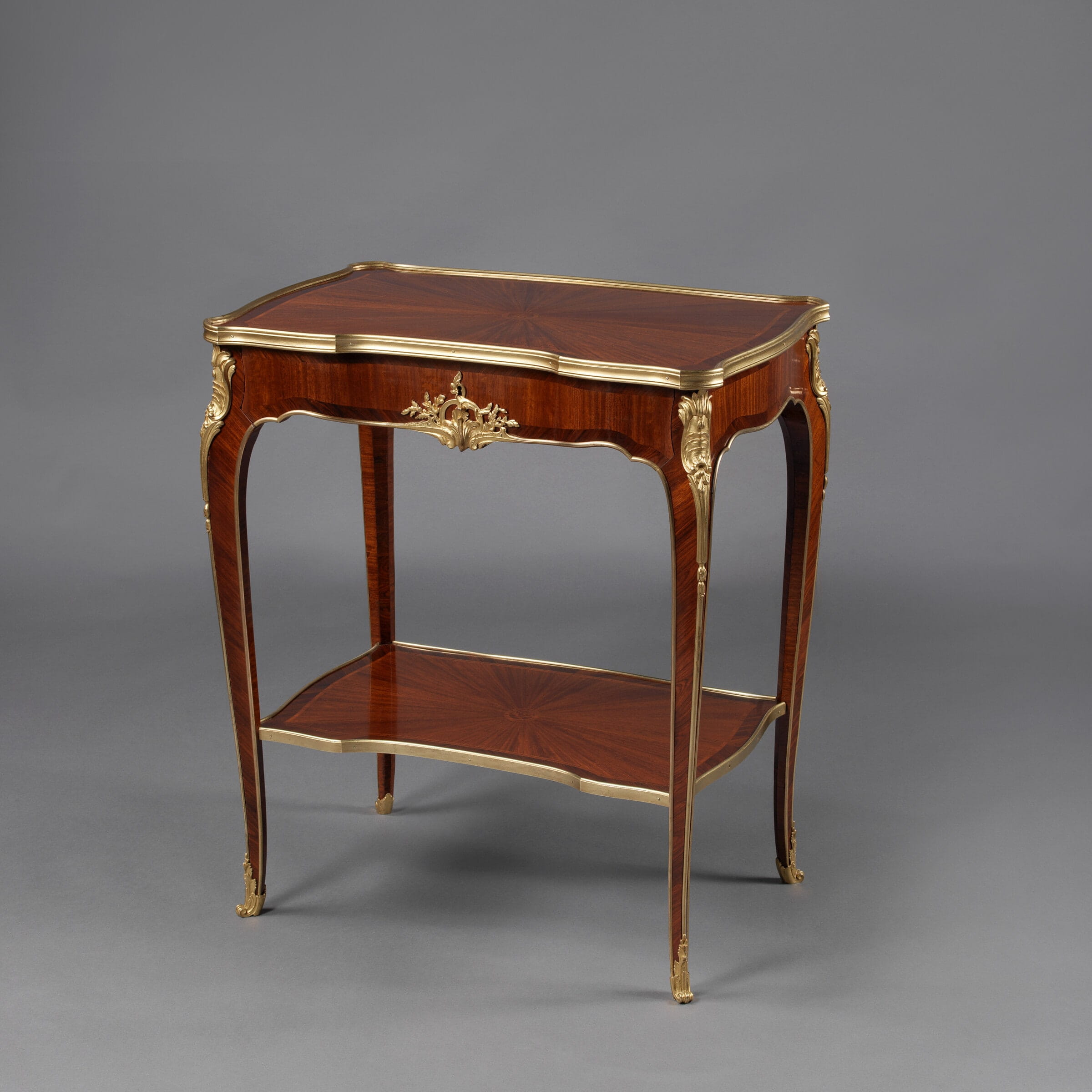 A Louis XV Style Gilt-Bronze Mounted Marquetry Salon Table