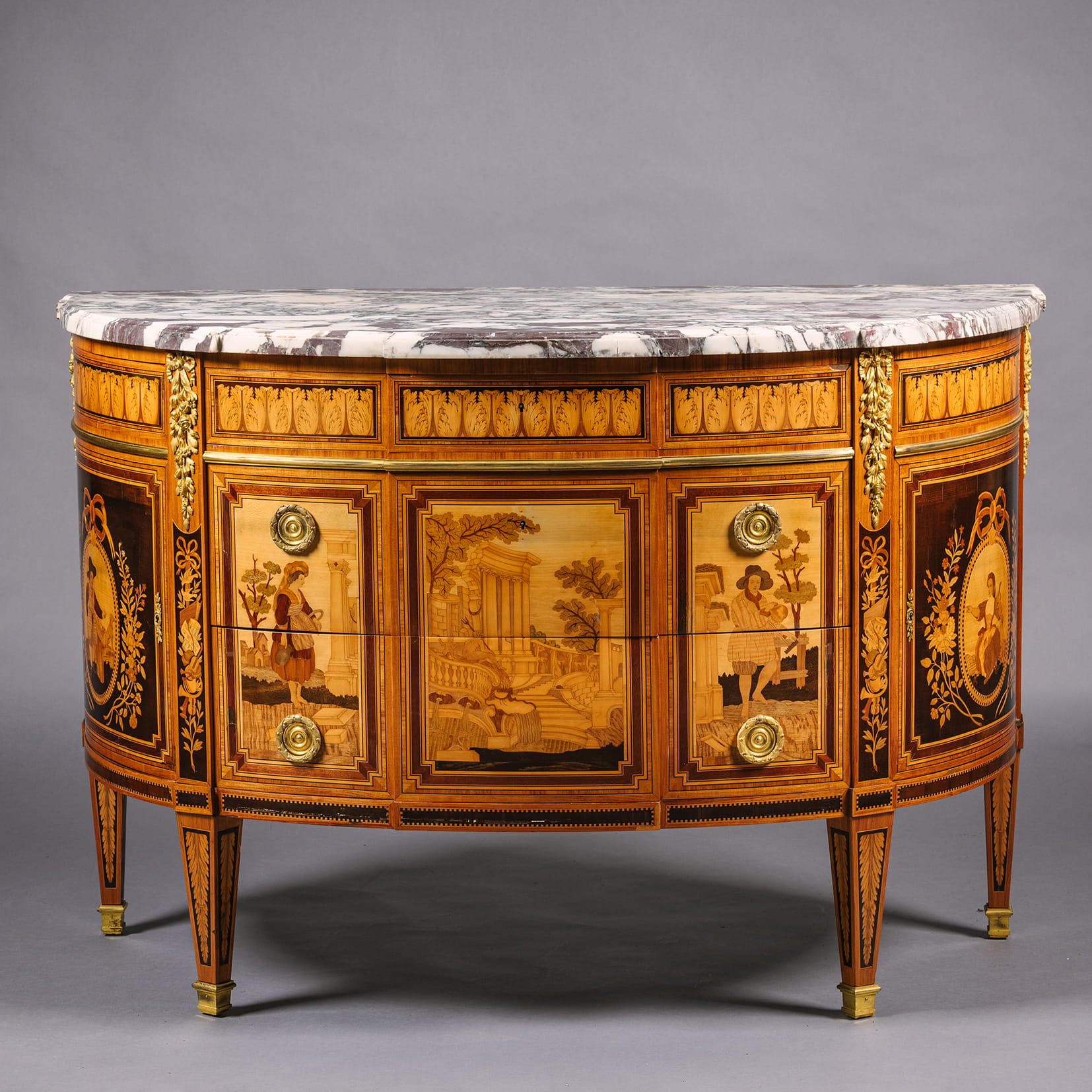 An Important Louis XVI Style Marquetry Inlaid Marble-Top Commode