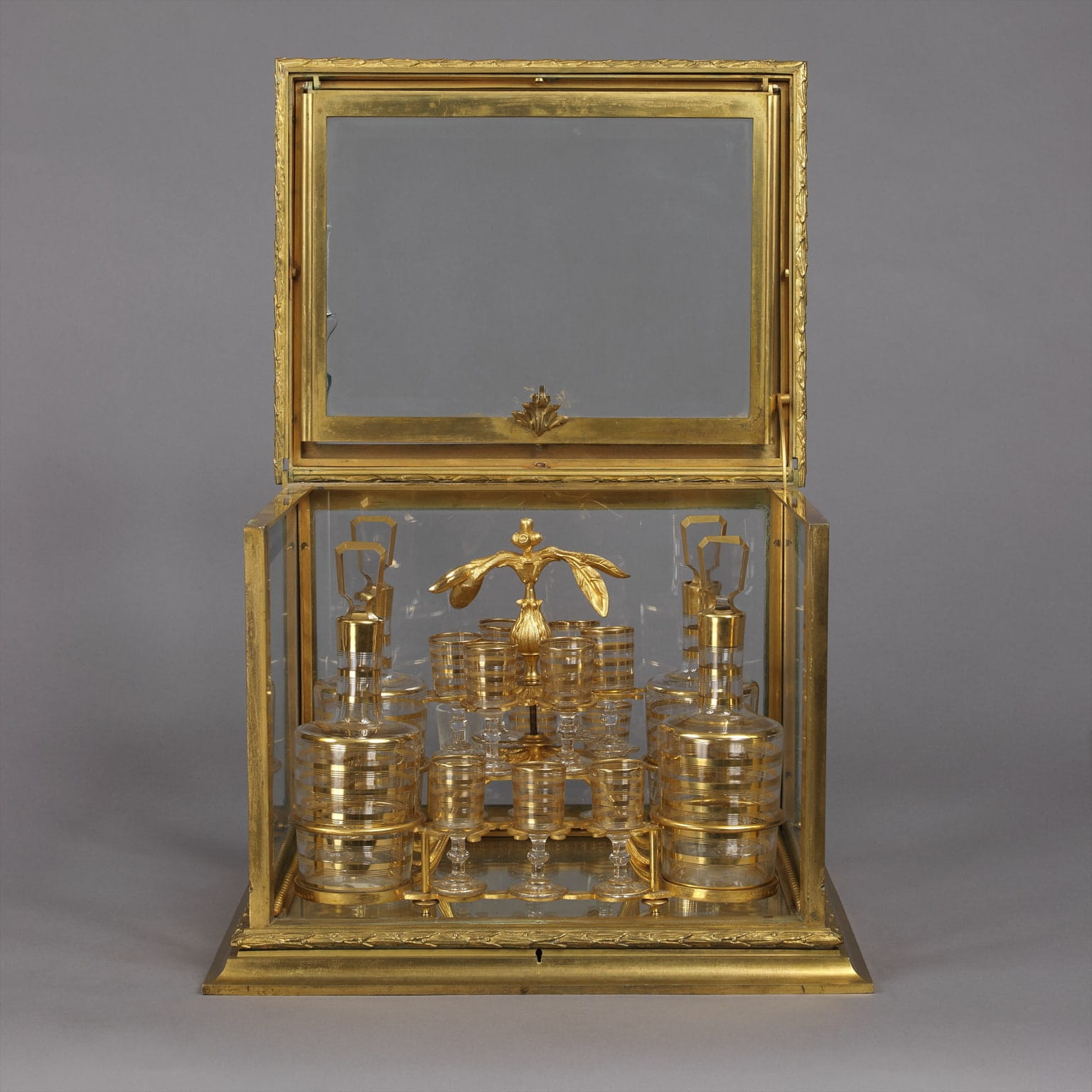 A Fine and Decorative Gilt-Bronze and Cut-Glass Decanter Set