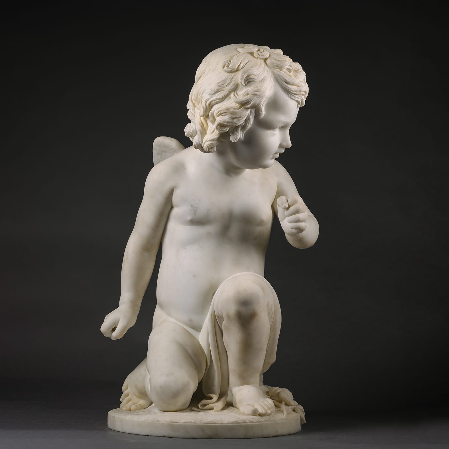 A Fine White Marble Figure of a Kneeling Cherub - Image 2