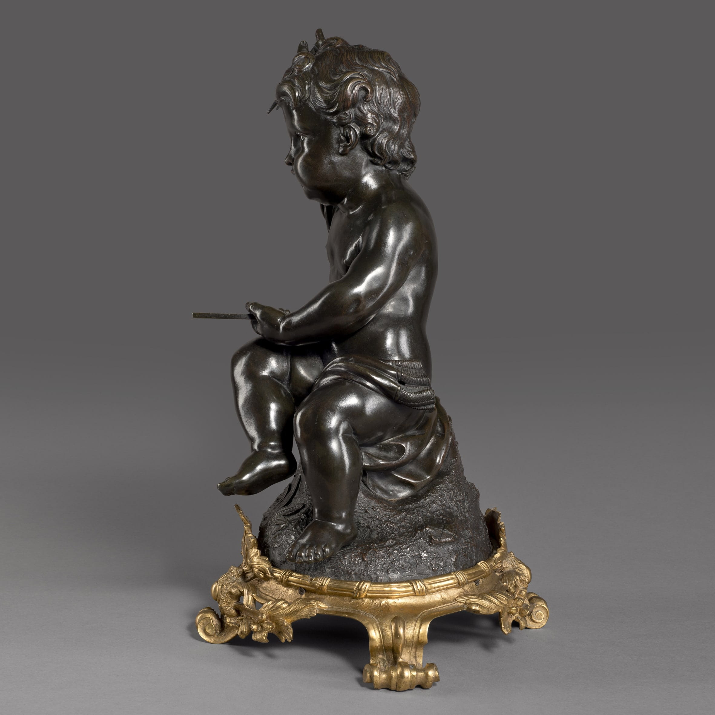 A Fine Patinated Bronze Putto Figure Emblematic of Architecture - Image 2