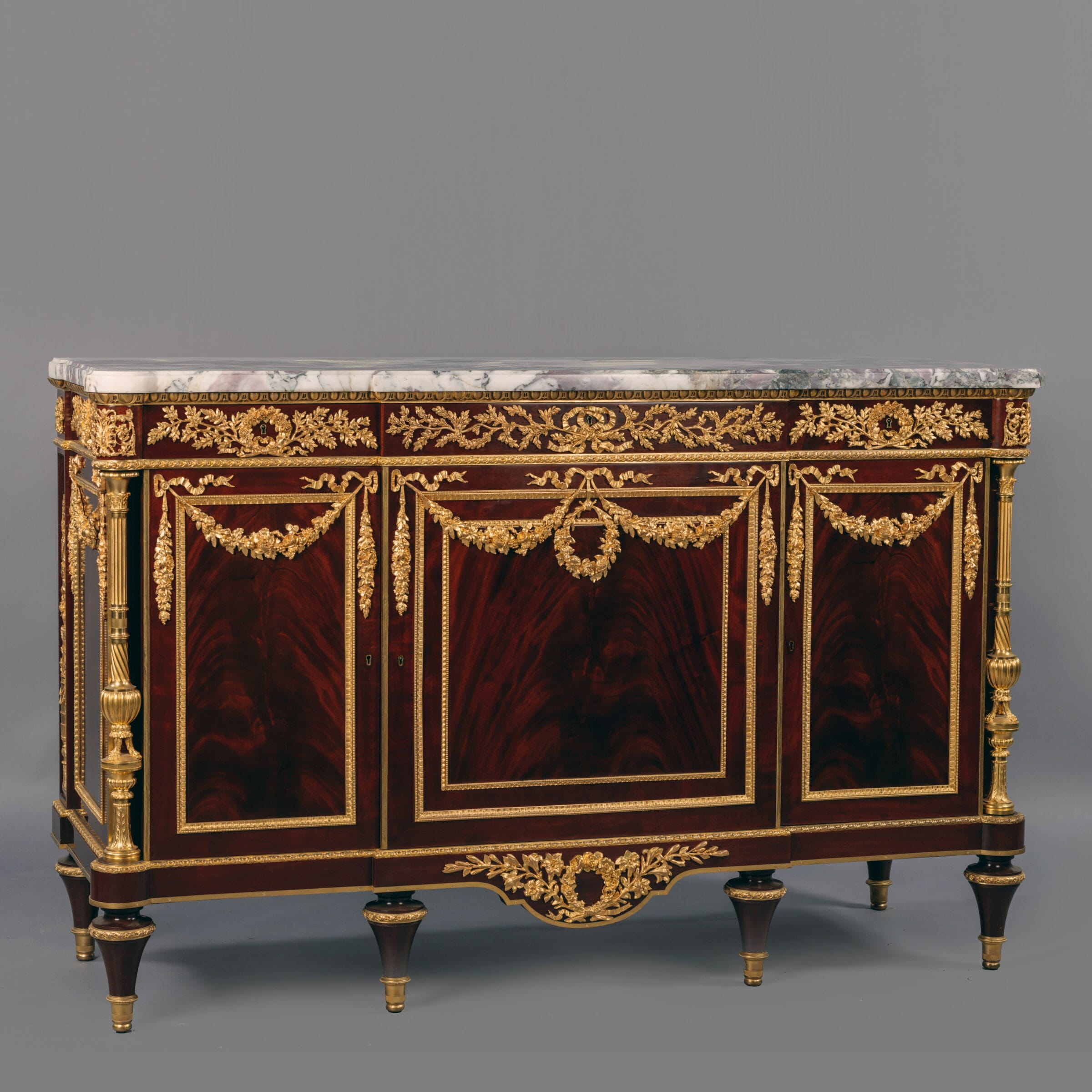 A Fine Louis XVI Style Gilt-Bronze Mounted Mahogany Commode, After The Model By Martin Carlin