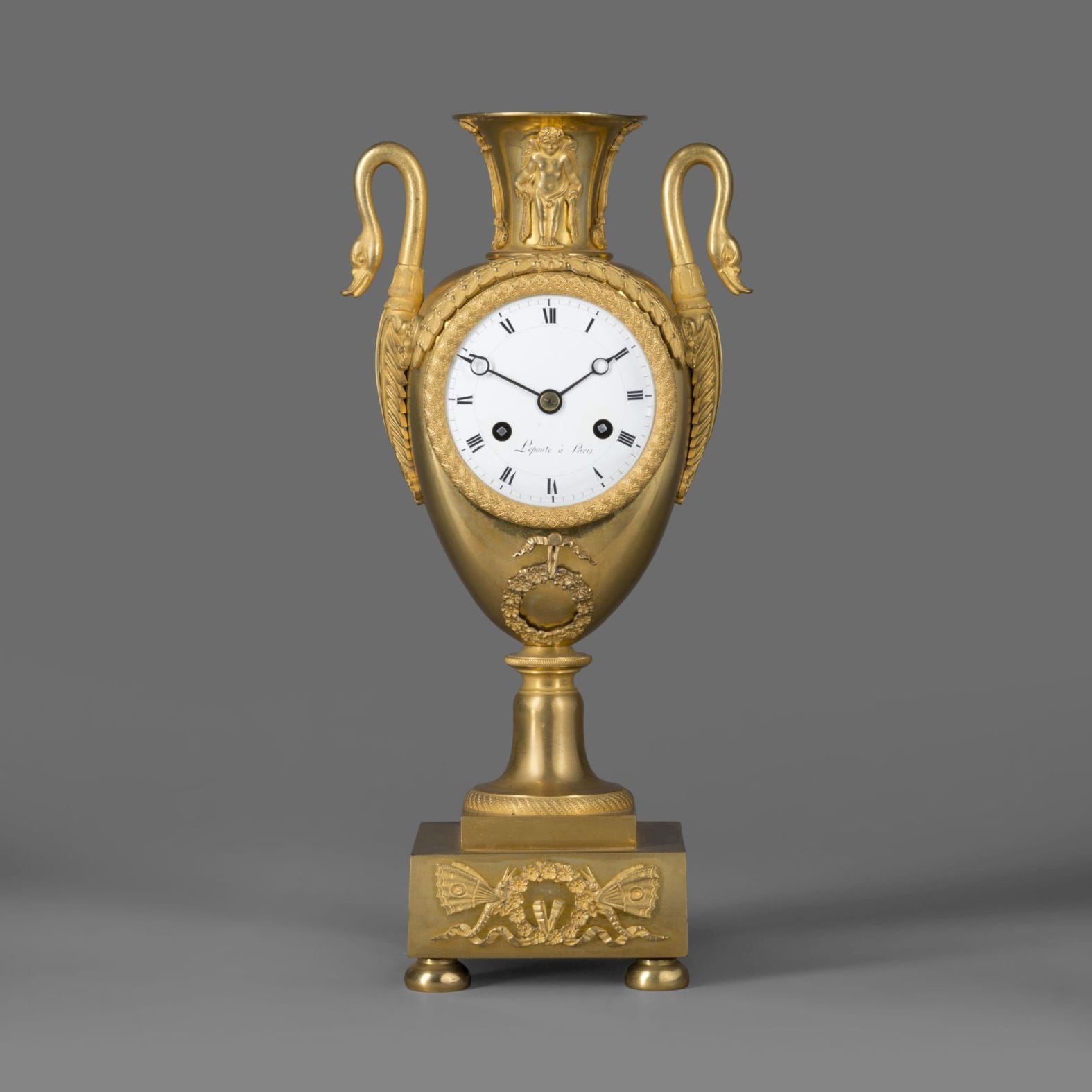 A Gilt-Bronze Empire Clock In The Form Of a Classical Urn