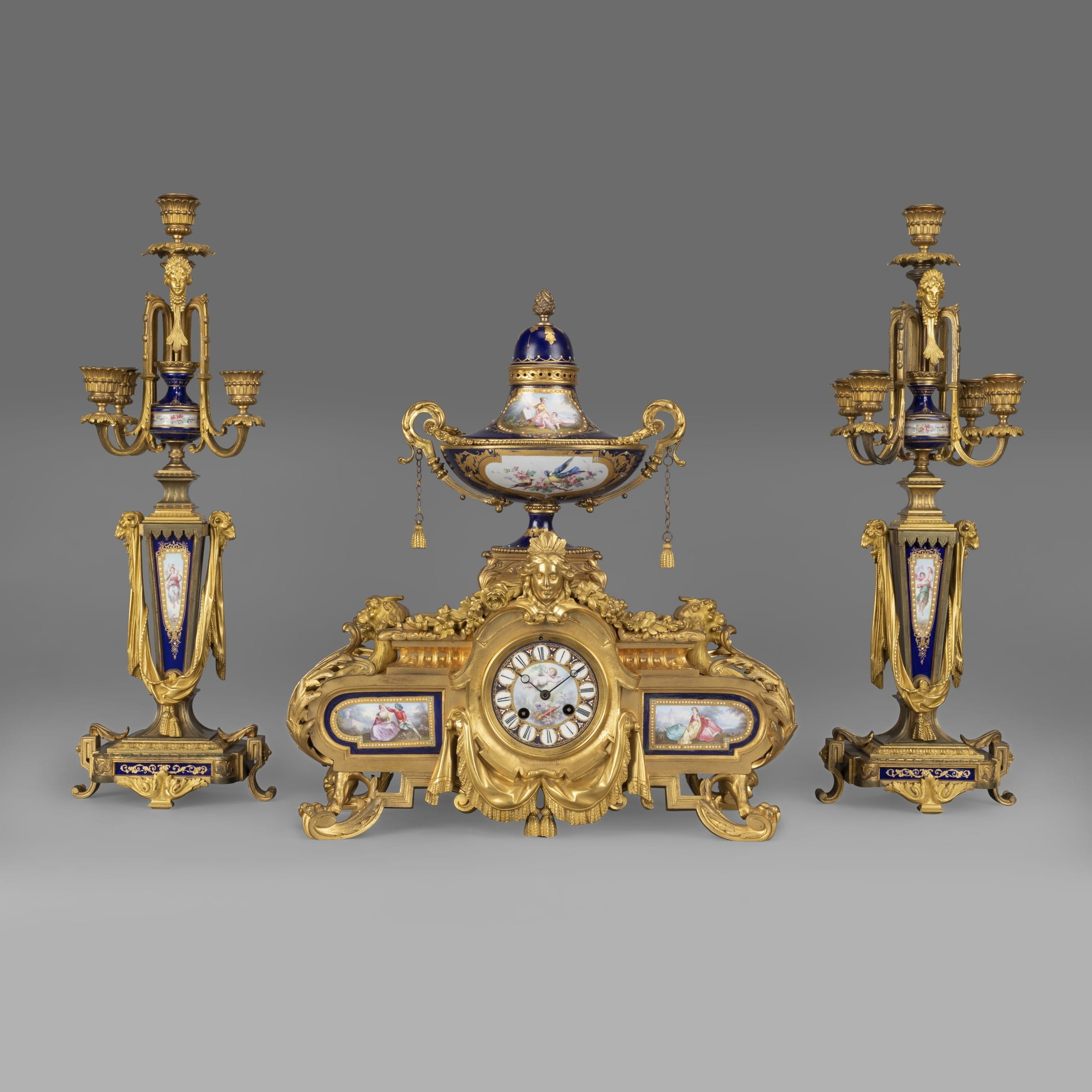 A Napoleon III Porcelain Mounted Clock Garniture