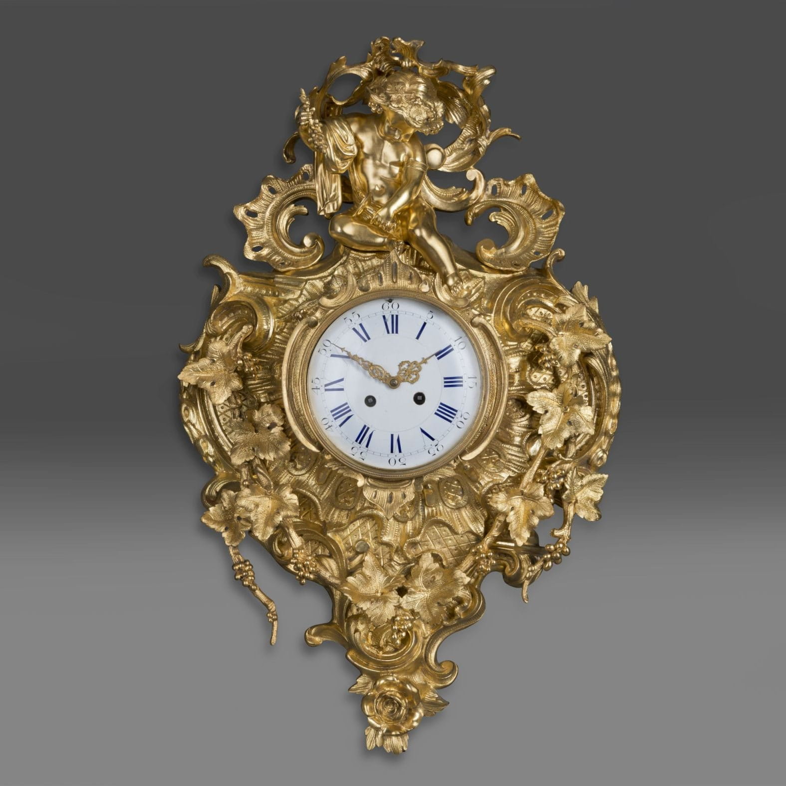 An Elaborate Louis XV Style Gilt-Bronze Cartel Clock