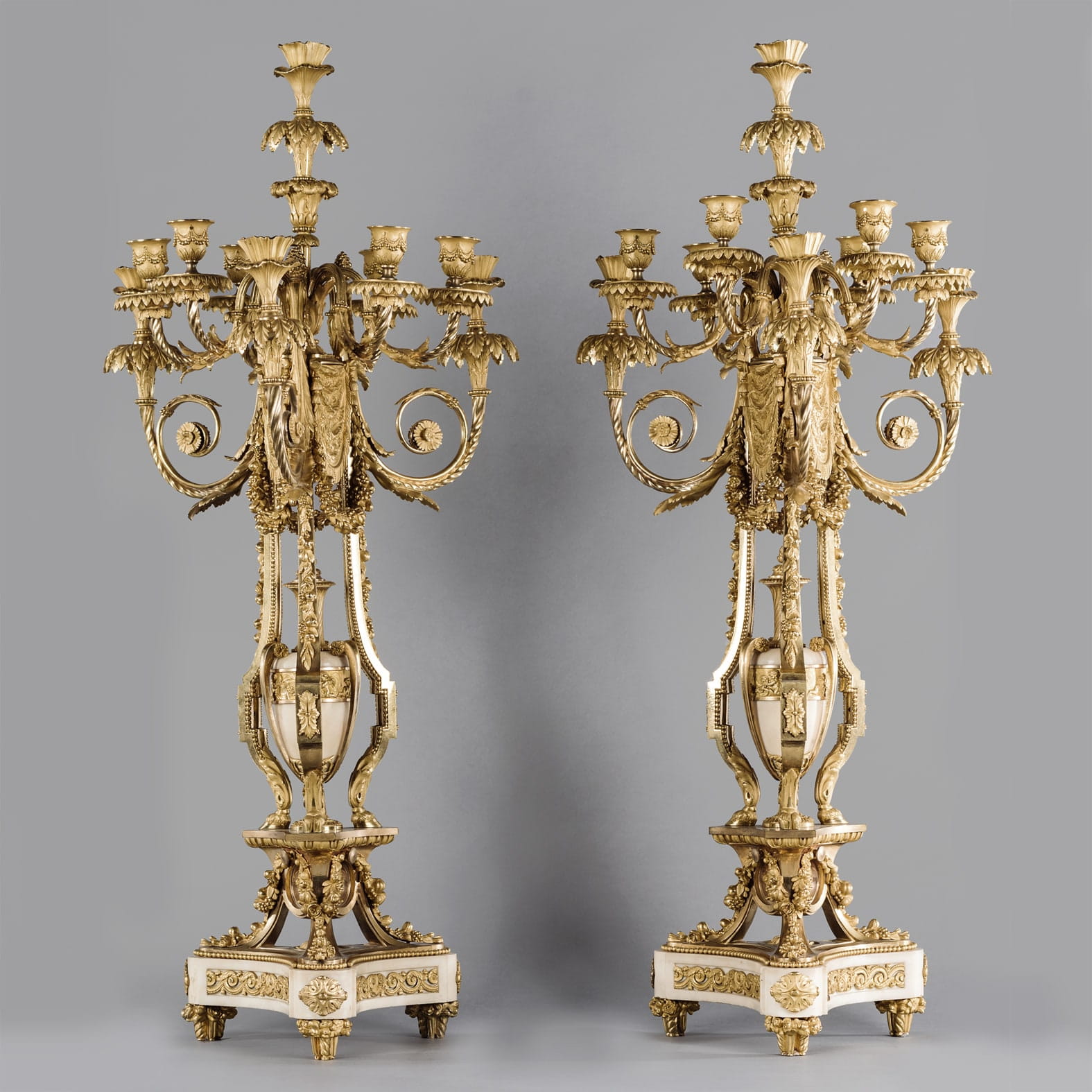 A Pair Of Ten-Light Candelabra After The Model by Pierre Gouthière