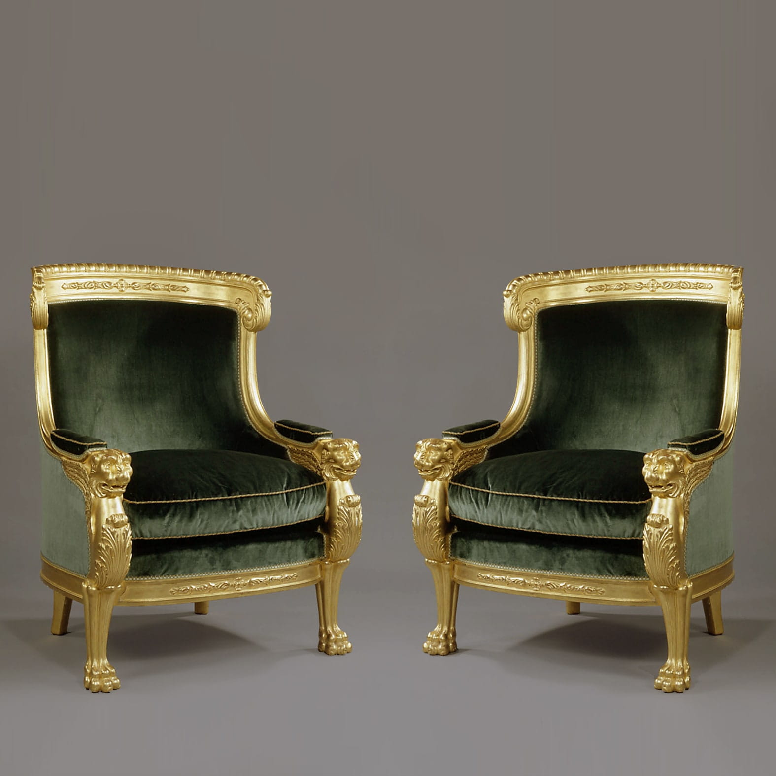 An Important Pair of Empire Style Carved Giltwood Tub Chairs