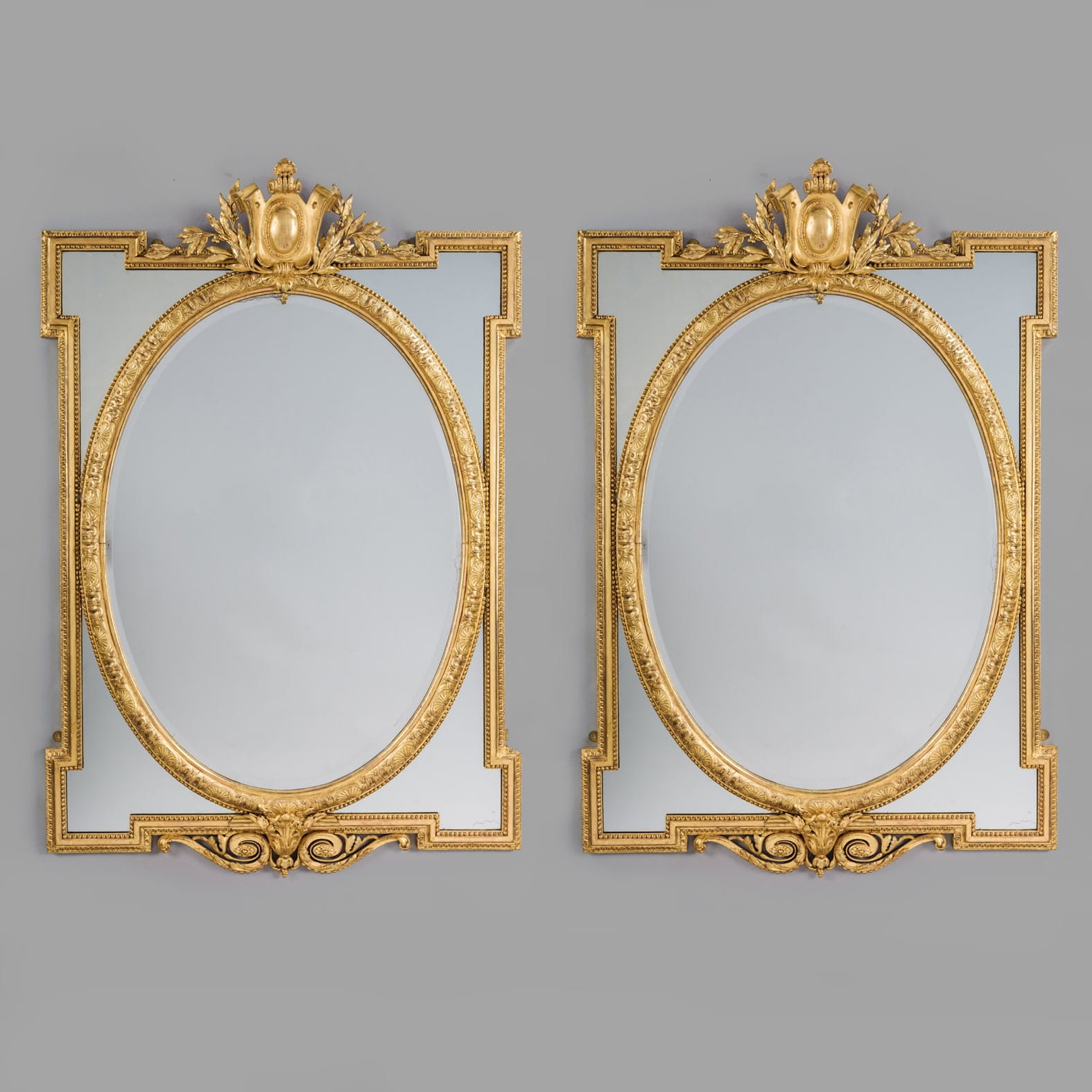 A Fine Pair of Louis XVI Style Giltwood Marginal Frame Mirrors