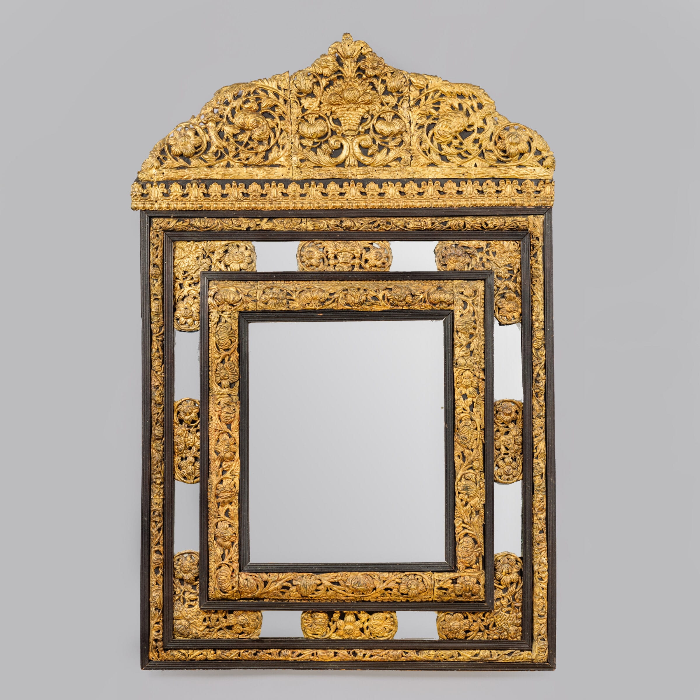 A Fine Dutch Ebonised and Repousse Gilt-Metal Cushion Mirror