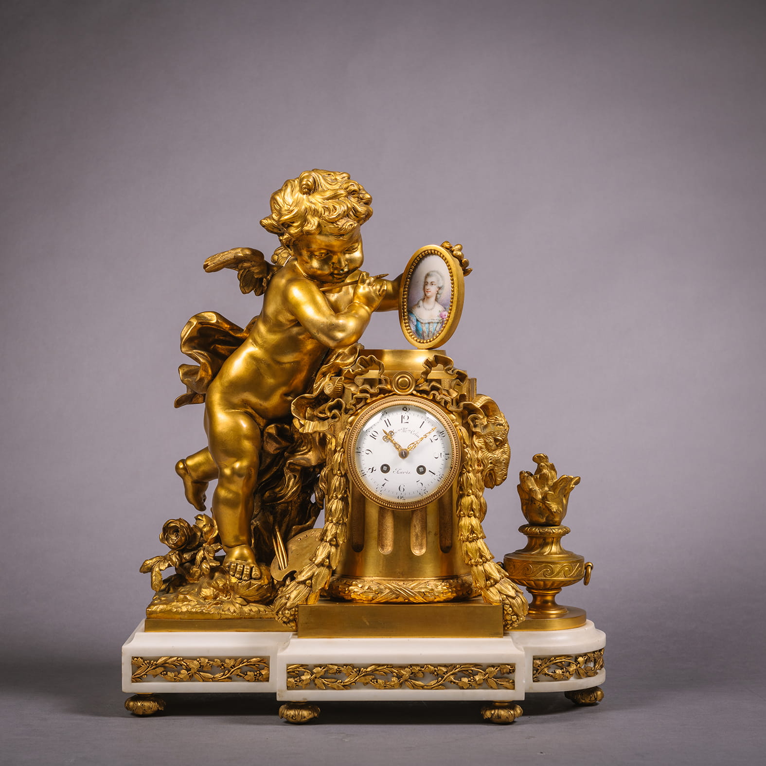 A Louis XVI Style Gilt-Bronze and Sèvres Style Porcelain Mounted Figural Clock, Allegorical of the Arts